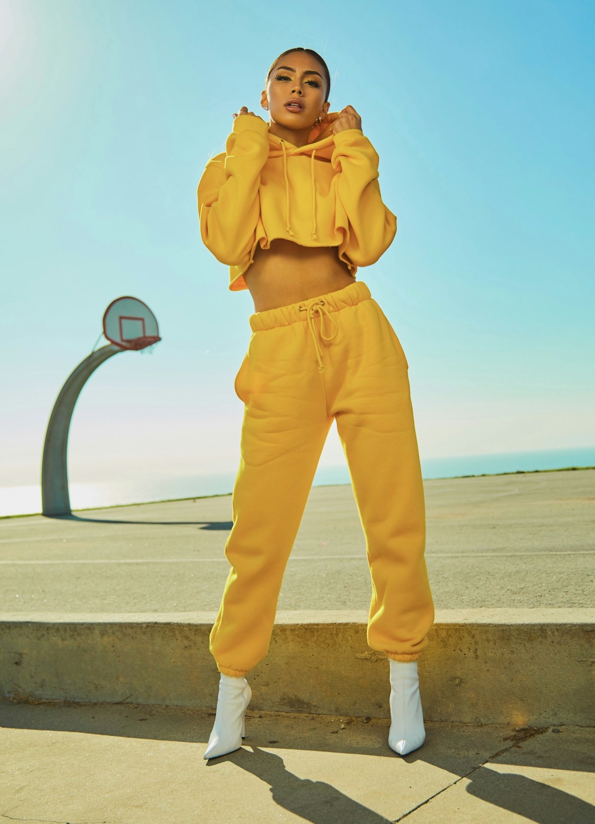 Fierce confident mature woman in red fashion look DevilsMilfs